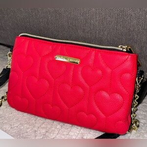 Betsey Johnson crossbody purse and/or clutch with removable strap.
